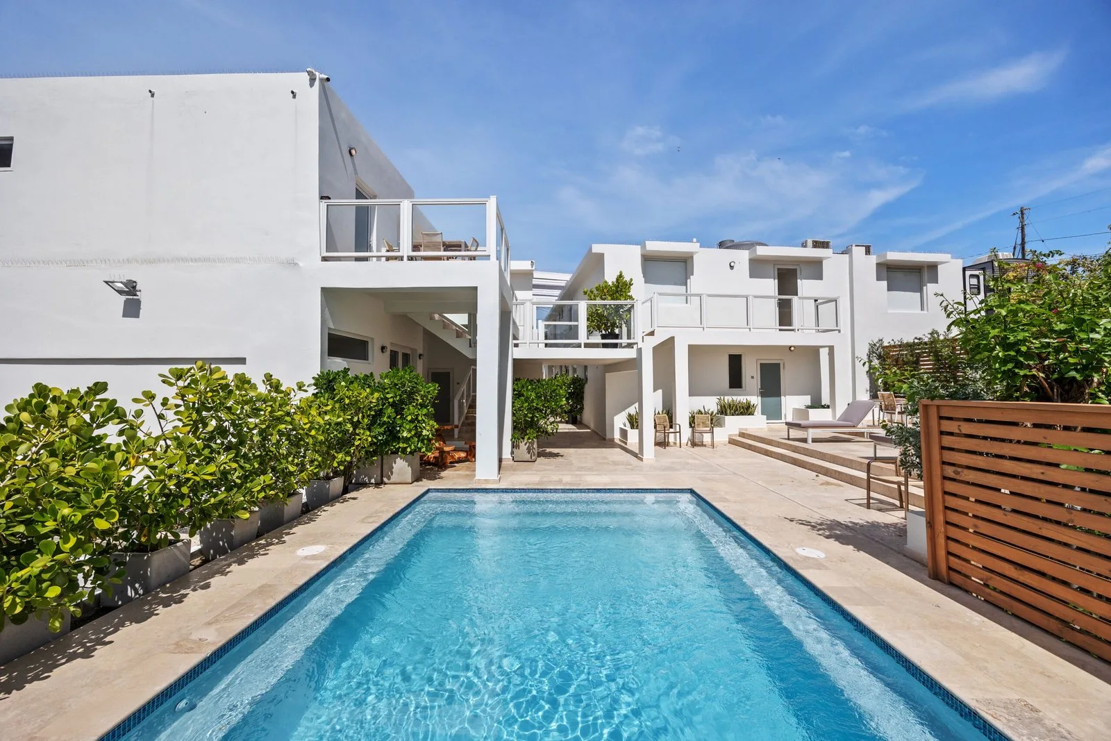 Pool and white buildings at Anchors Hotel