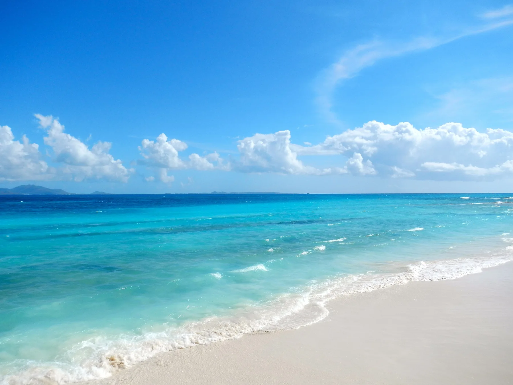 Turquoise water and beach near Seaside Splendor